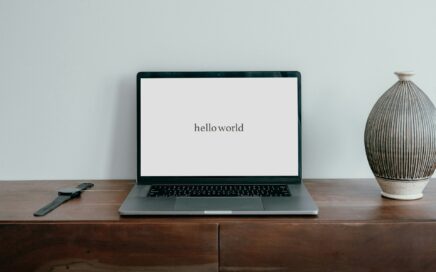laptop that says Hello World.