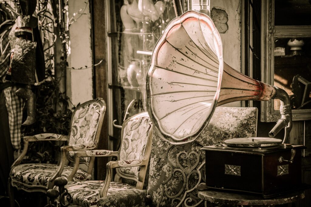 gramophone and old-fashioned upholstered chairs with paisley pattern