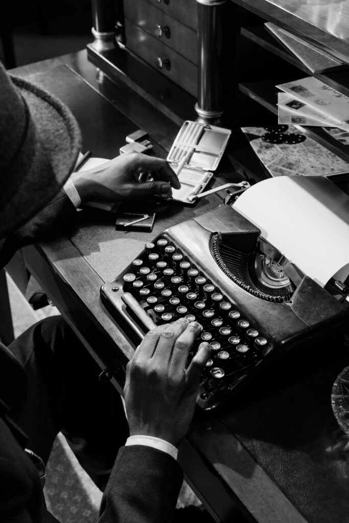 man using typewriter