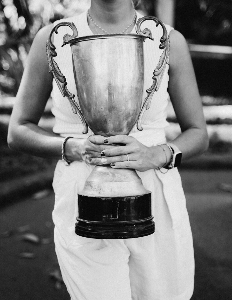 woman holding trophy