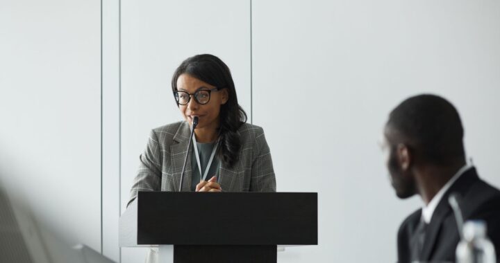 reading at podium